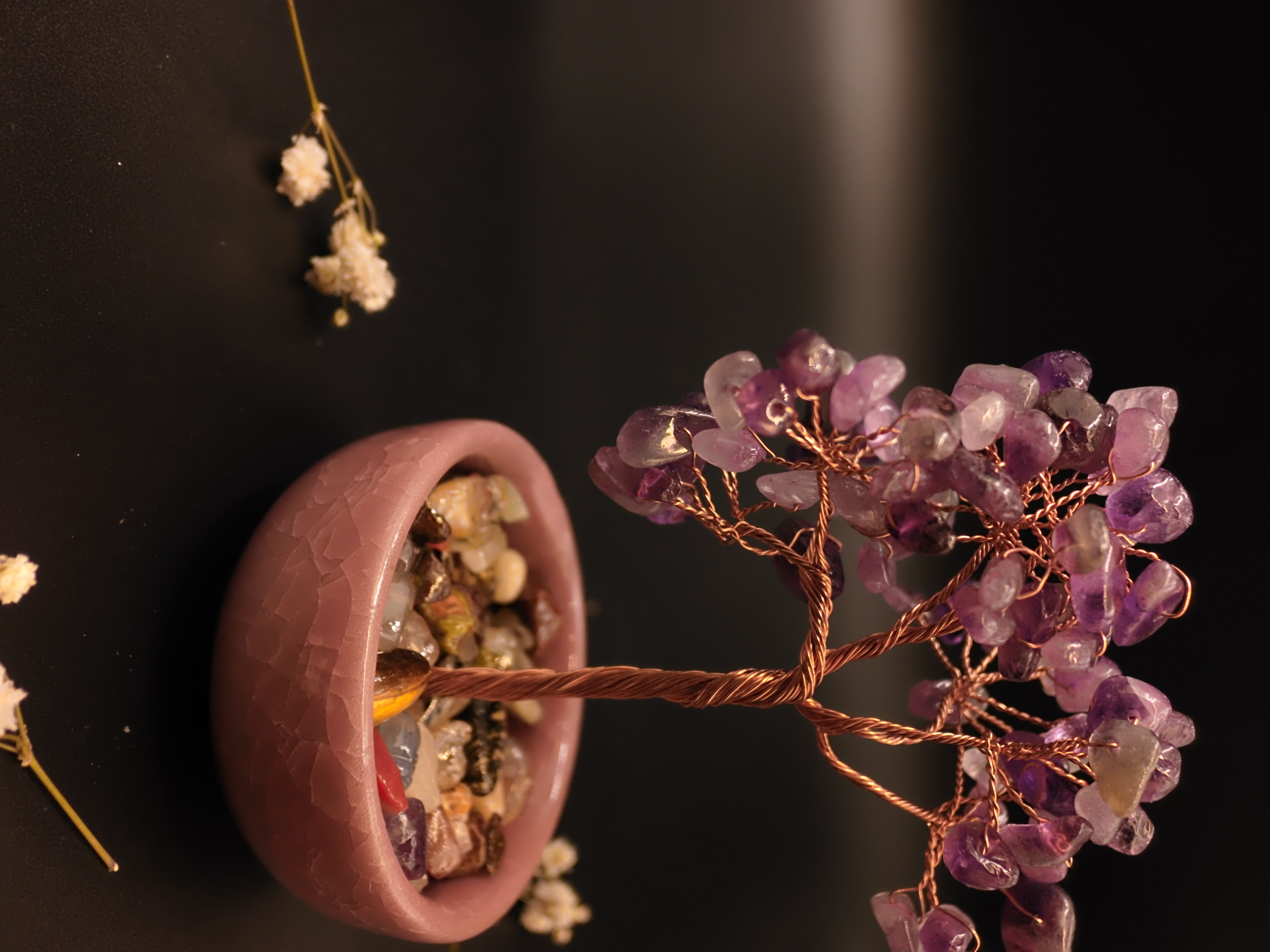 Amethyst crystal wish tree close-up of translucent purple gemstone chips on copper wire branches