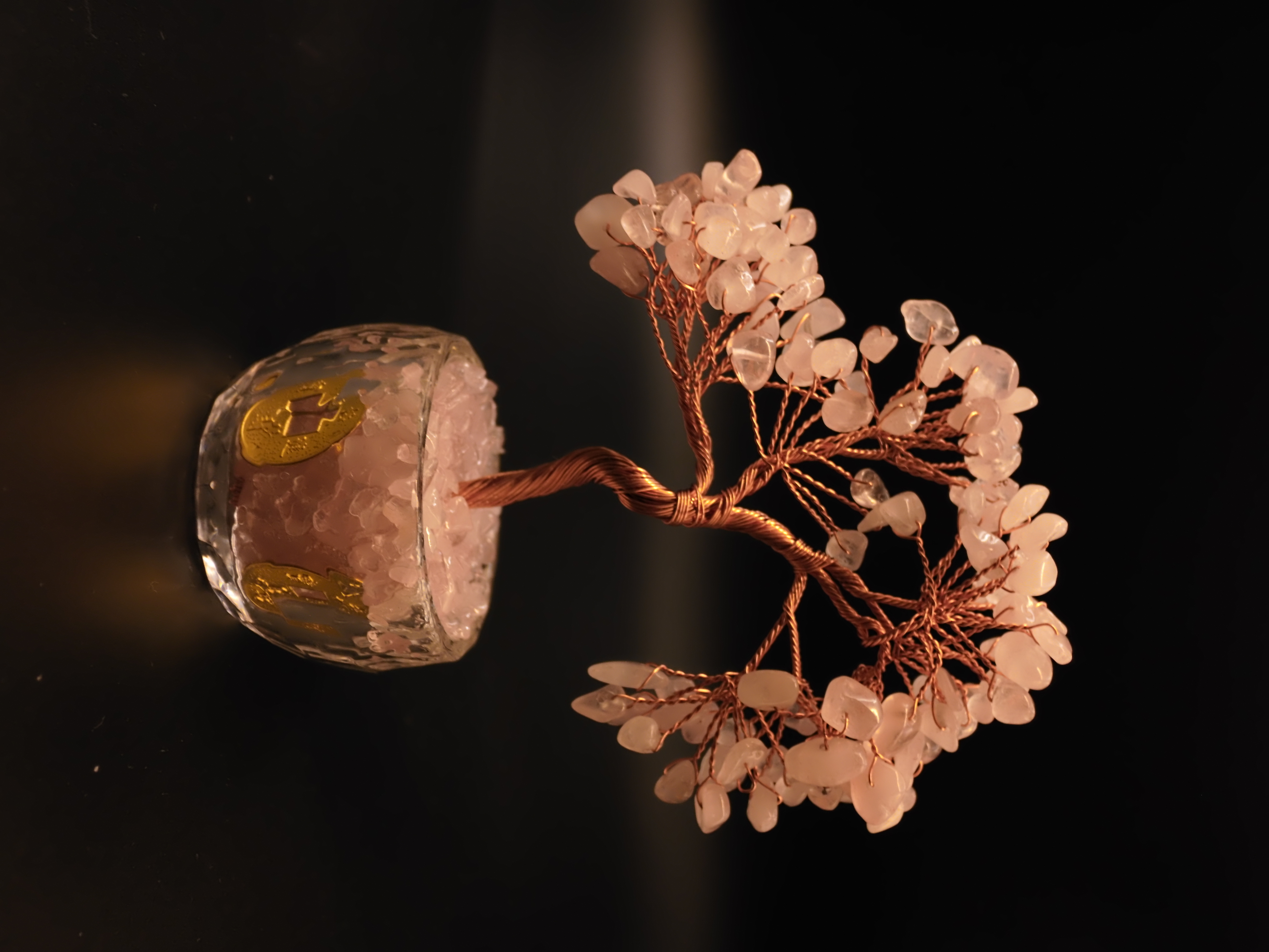 Rose quartz Feng Shui wish tree in crystal glass bowl with embossed gold lucky coins full view